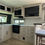 Thumbnail: Interior kitchen with cupboards, microwave, oven, and drawers. New 2026 Dutchmen Astoria 26RK. LOCAL RV DEALERSHIP