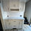 Thumbnail: White RV kitchen with cabinetry and backsplash; Nwe 2025 Prime Time Avenger 28QBSLE.