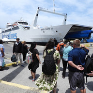 Group awaiting the bus in Corfu harbor