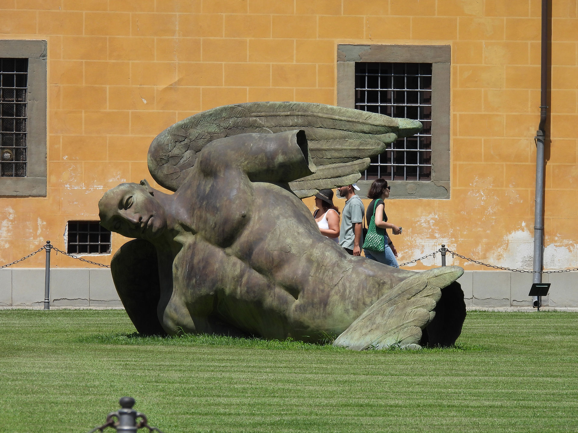 "Fallen Angel" sculpture on the lawn of the Cathedral of Pisa
