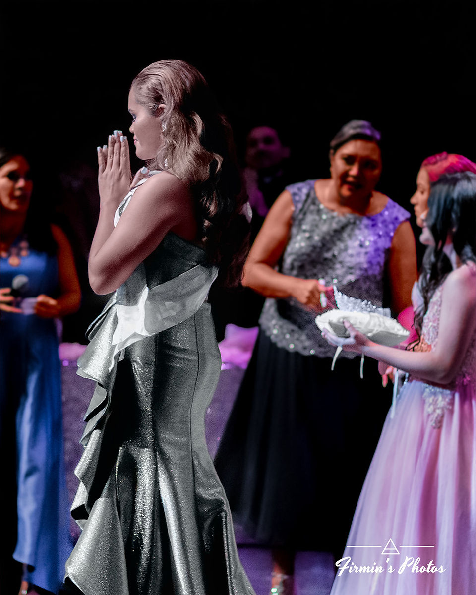 Woman praying in praise after winning event