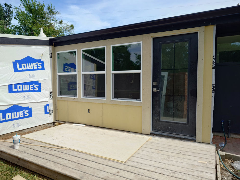 Building extension with large windows and glass door.