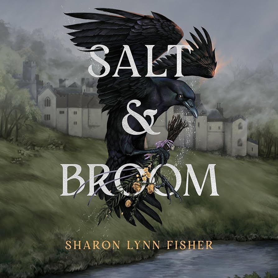 Audiobook cover for “Salt & Broom” by Sharon Lynn Fisher. A large black raven in flight carries a bundle of twigs and herbs in its beak, set against a misty background of medieval buildings and countryside. White serif title text overlays the bird.
