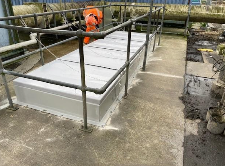 The client needed weatherproof covers over apertures in a concrete slab that were used to remove large pumps from a dry-well. The covers consisted of lightweight hinged panels mounted on a GRP upstand that were easily operated from behind the safety handrailing.