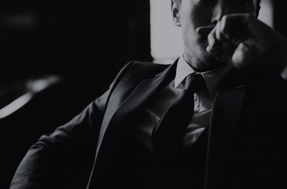 image of a suited man thinking