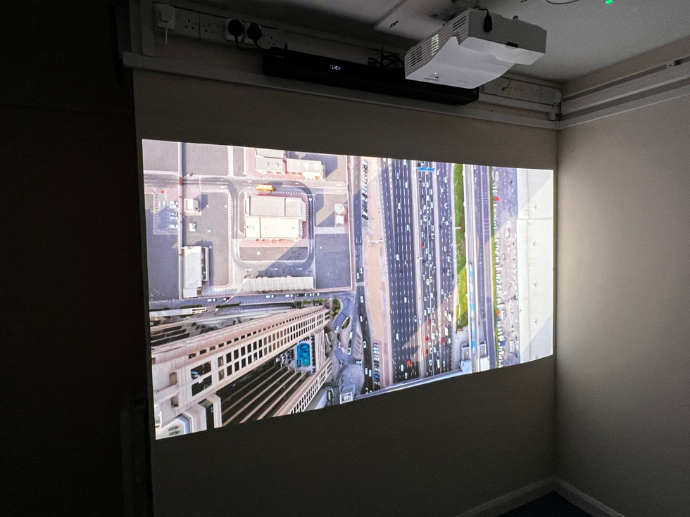 The HD TV 1080p projector and Dolby Atmos Sound bar linked to Apple TV for a great cinema experience.