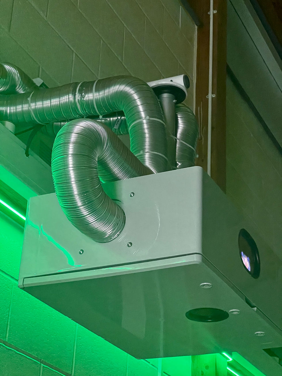 An IP 65 waterproof box housing the 4K projector with the metal inlet and outlet ventilation system