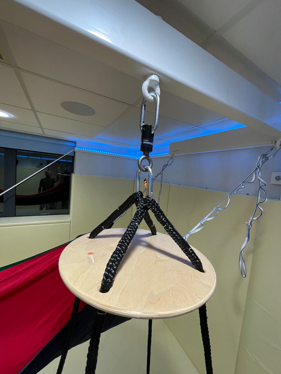 the bespoke white powder coated hanging beam with hanging points, safety carabiners