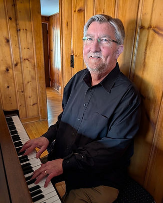 JimAtPiano_edited.jpg