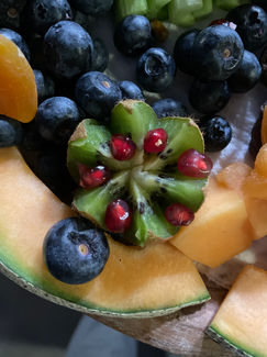 Kiwi Flower with blueberries, pomegranate seeds, and cantelope