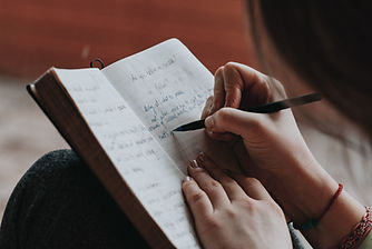 Woman writing_marcos-paulo-prado.jpg