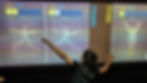 Child participating in an interactive movement game at the Perot Museum of Nature and Science.