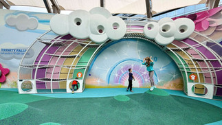 Children playing in the outdoor discovery area at the Perot Museum of Nature and Science.