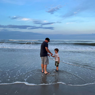 Family enjoying the shoreline at Atlantic Beach, Florida.