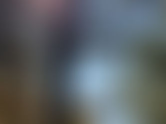 Sunlight shining through tall pine trees overlooking Wright Patman Lake at Atlanta State Park in fall.