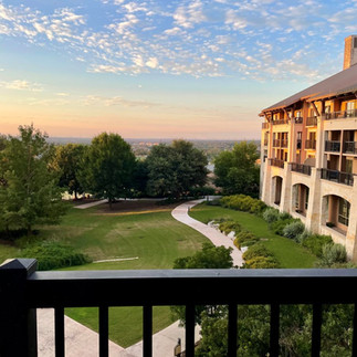 View overlooking the JW Marriott San Antonio Hill Country Resort & Spa grounds at sunset.