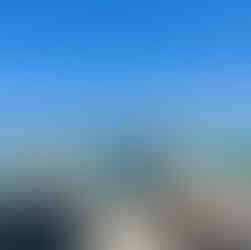 Child wearing a life jacket looking out at the ocean during a boat day in Destin Florida.