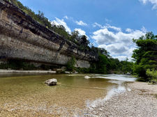 Clear water and limestone cliffs along the Guadalupe River at Guadalupe River State Park.