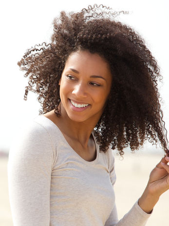 Black woman on the beach, client testimonial 