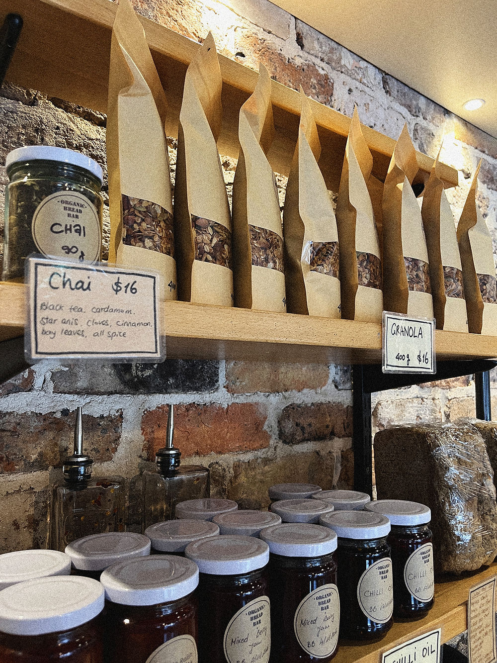 Shelves of chai, jams, and bagged organic goods