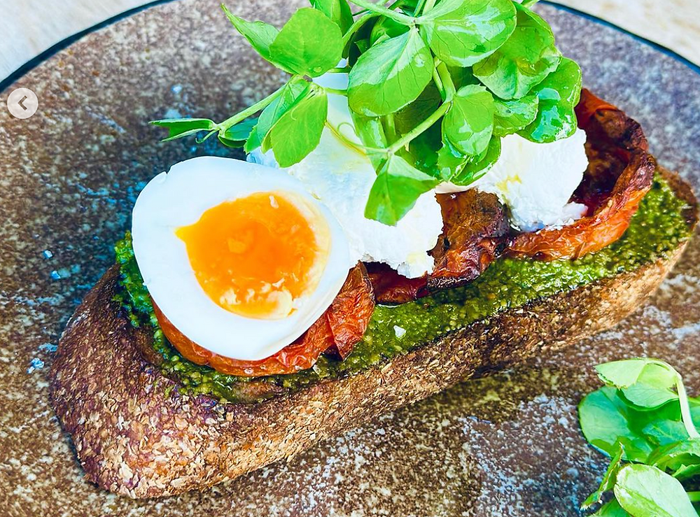 Organic bread bar gourmet toast with egg and pesto