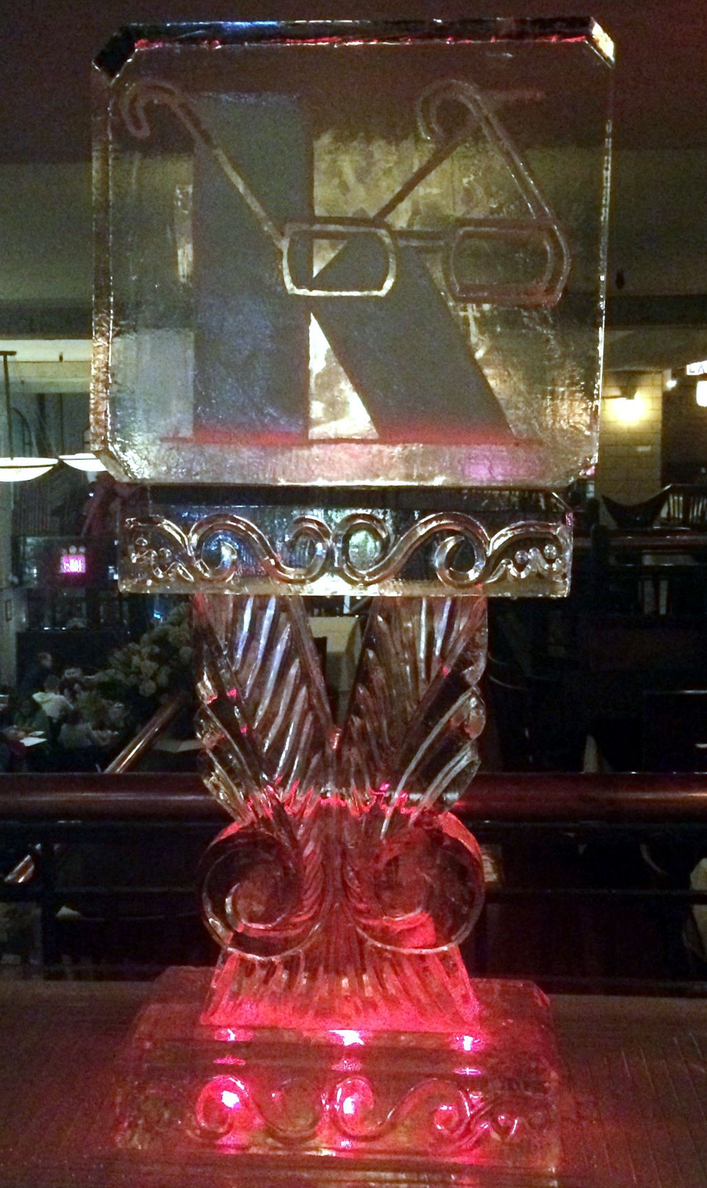 K with glasses logo on decorative pillar