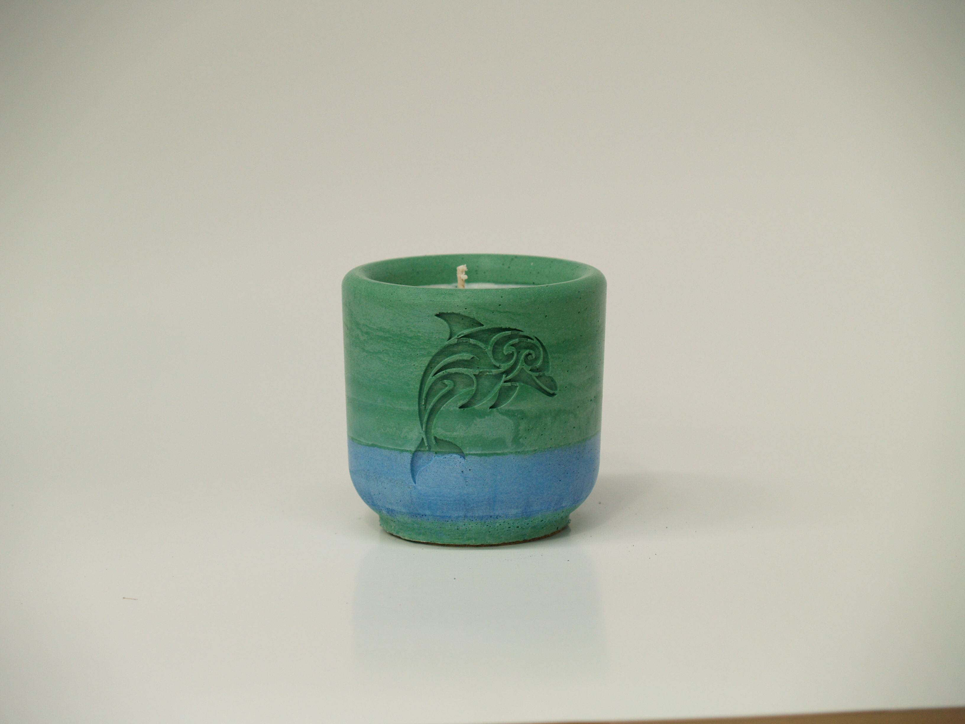 Handmade Round Candle - debossed tribal dolphin and azure coast scent