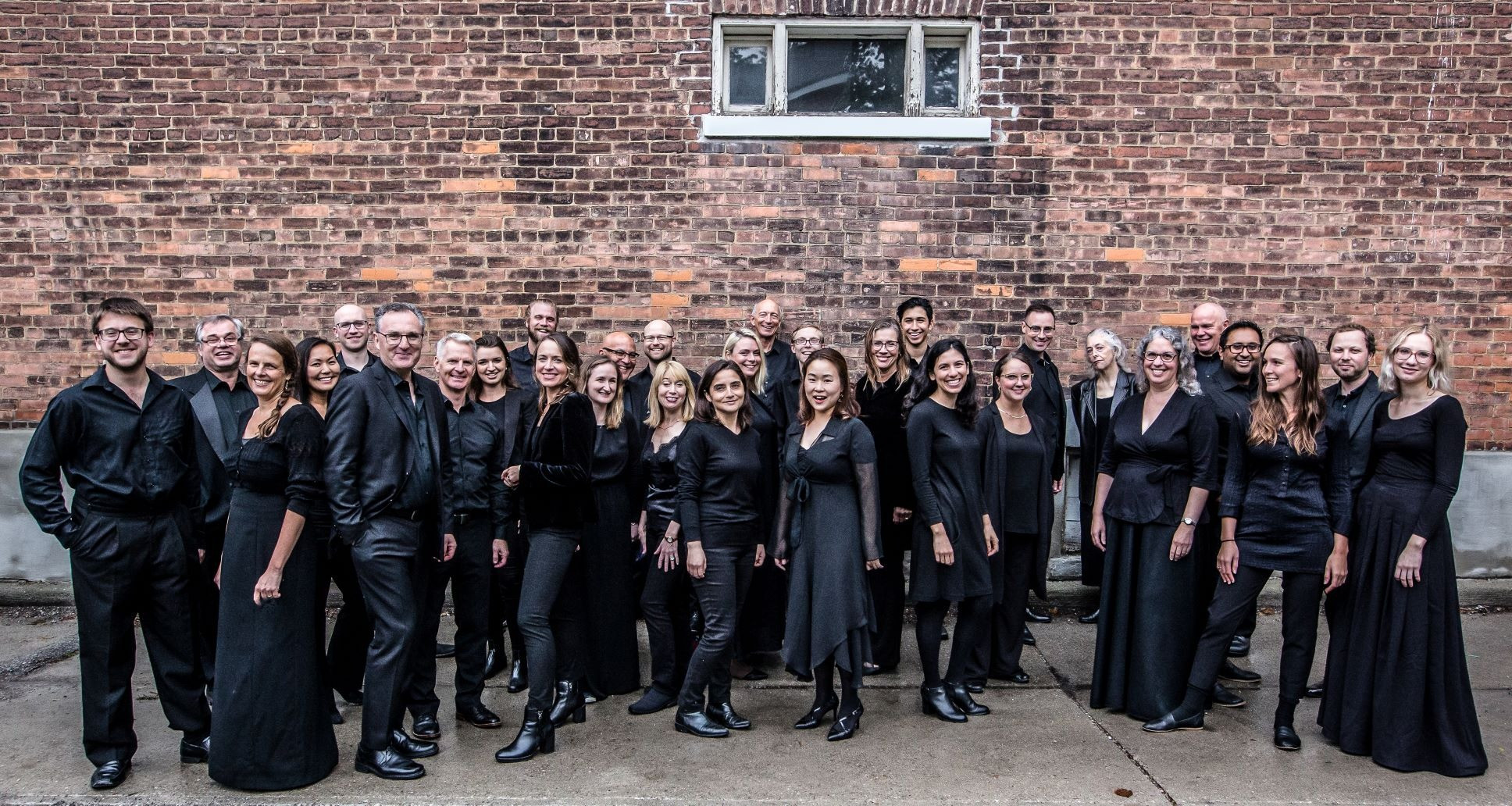 The Exultate Chamber Singers logo