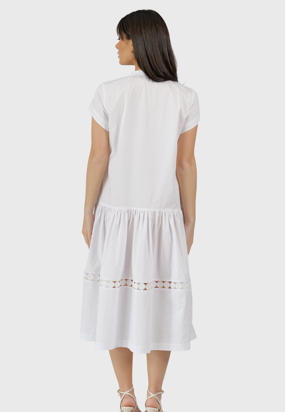 Back view of the white Capri cotton midi dress with lace inset