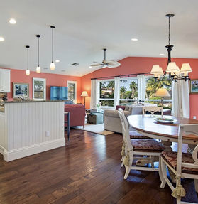 Contemporary kitchen renovation with white cabinets and island