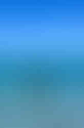 Father holding child in the ocean during a family beach trip, showing confidence and connection through travel