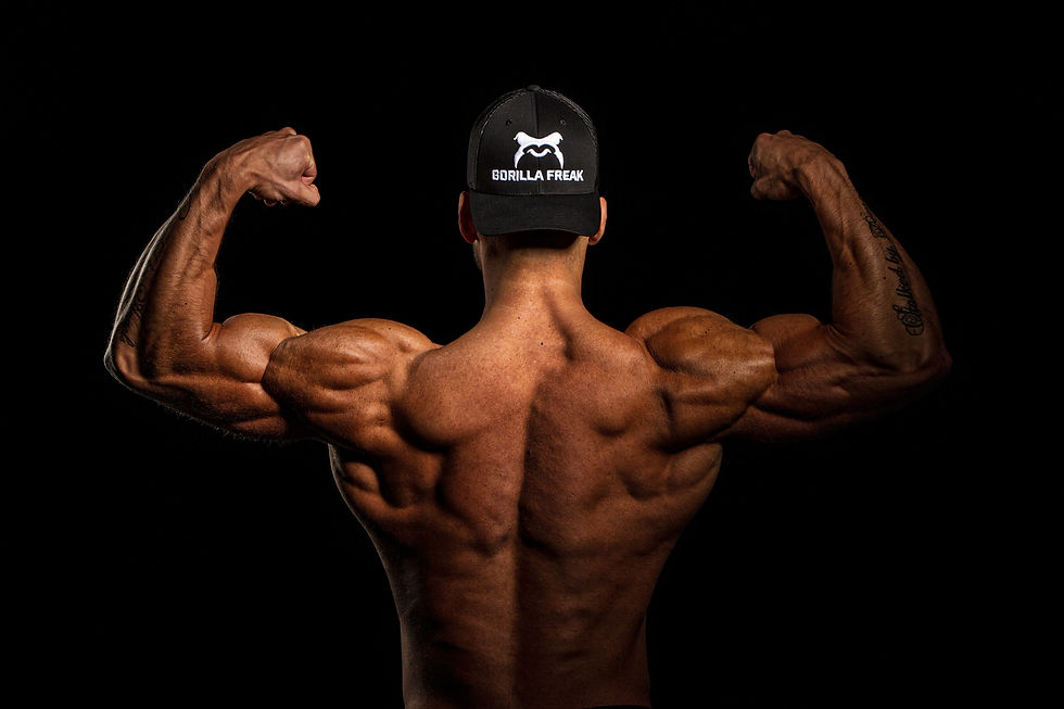 Weight lifter with extremely defined and bulky muscles having followed a strict fitness training plan.