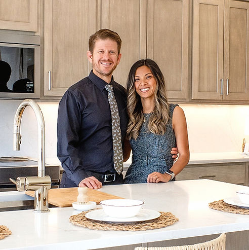 Stephen and Anna standing in a clean kitchen 