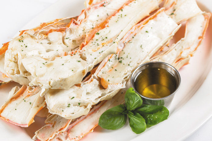 King Crab Legs Split Cooked In Butter and Herb