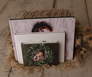 Our albums featuring newborn photos, designed with premium materials and craftsmanship to offer a timeless way to remember