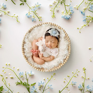 Newborn photography Melbourne showing baby girl in soft natural newborn pose during full session