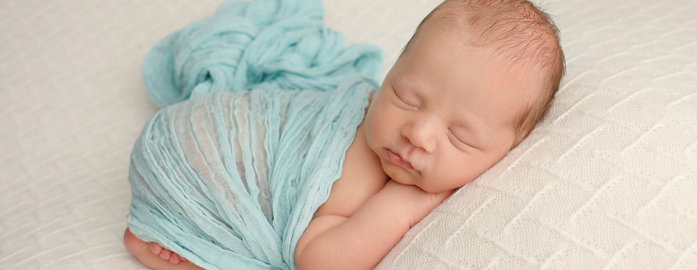 Newborn Photography Melbourne ā Sleeping Baby Wrapped in Teal Wrap