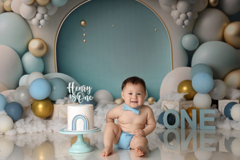 Frankston cake smash photography – baby laughing with cake-covered face in studio