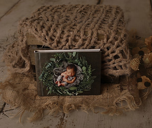 Luxury custom albums showcasing high-quality newborn photography, with options for personalized covers and elegant layouts