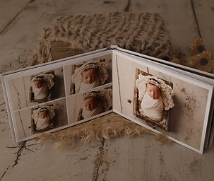 Beautifully crafted custom albums featuring newborn photos, designed to preserve and showcase your cherished memories
