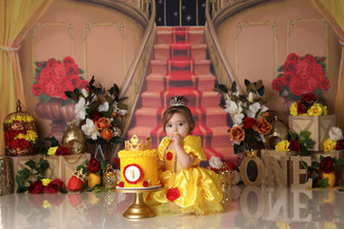 Cake smash photographer Berwick – baby in colourful rainbow set with custom cake