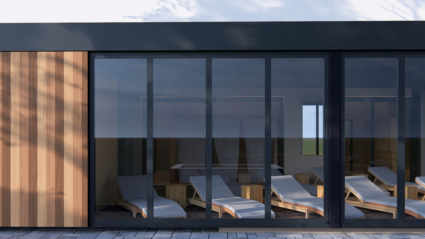 Moderní odpočívárna ve wellness centru MONA@CO s výhledem do zeleně a lehátky.