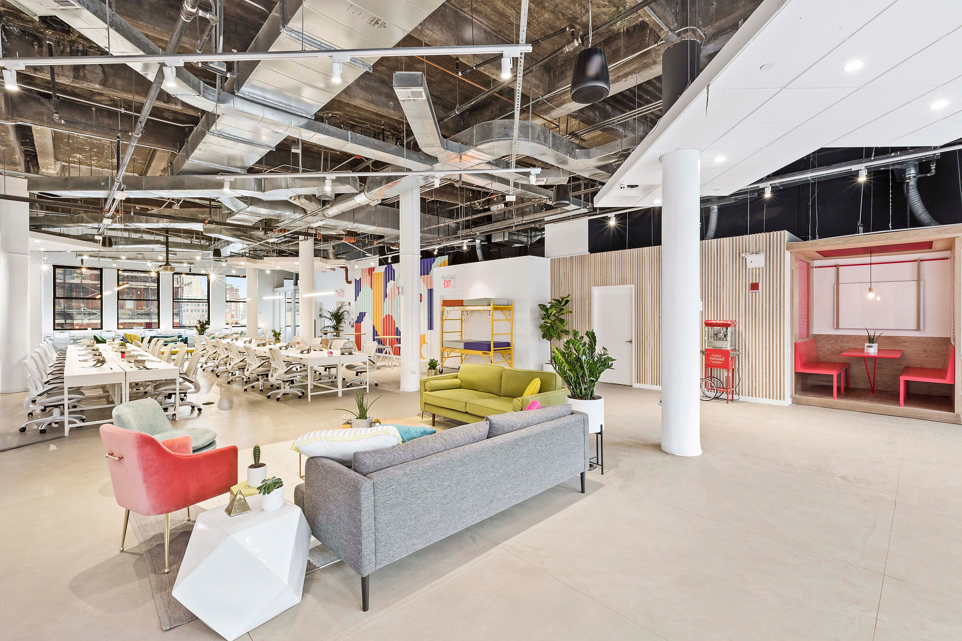 Cheerful workspace with colorful furniture and a ceiling fan, adding a touch of freshness, creating a stimulating atmosphere.