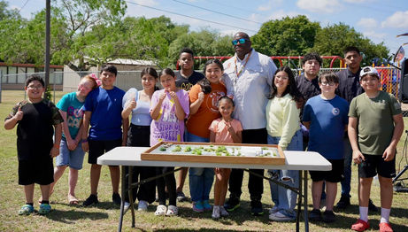 Super with kids and model 2 (1)