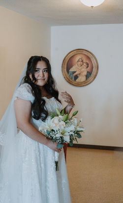 bride with mother Mary in background tlm catholic wedding day