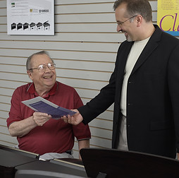Teacher_handing_out_music2.jpg