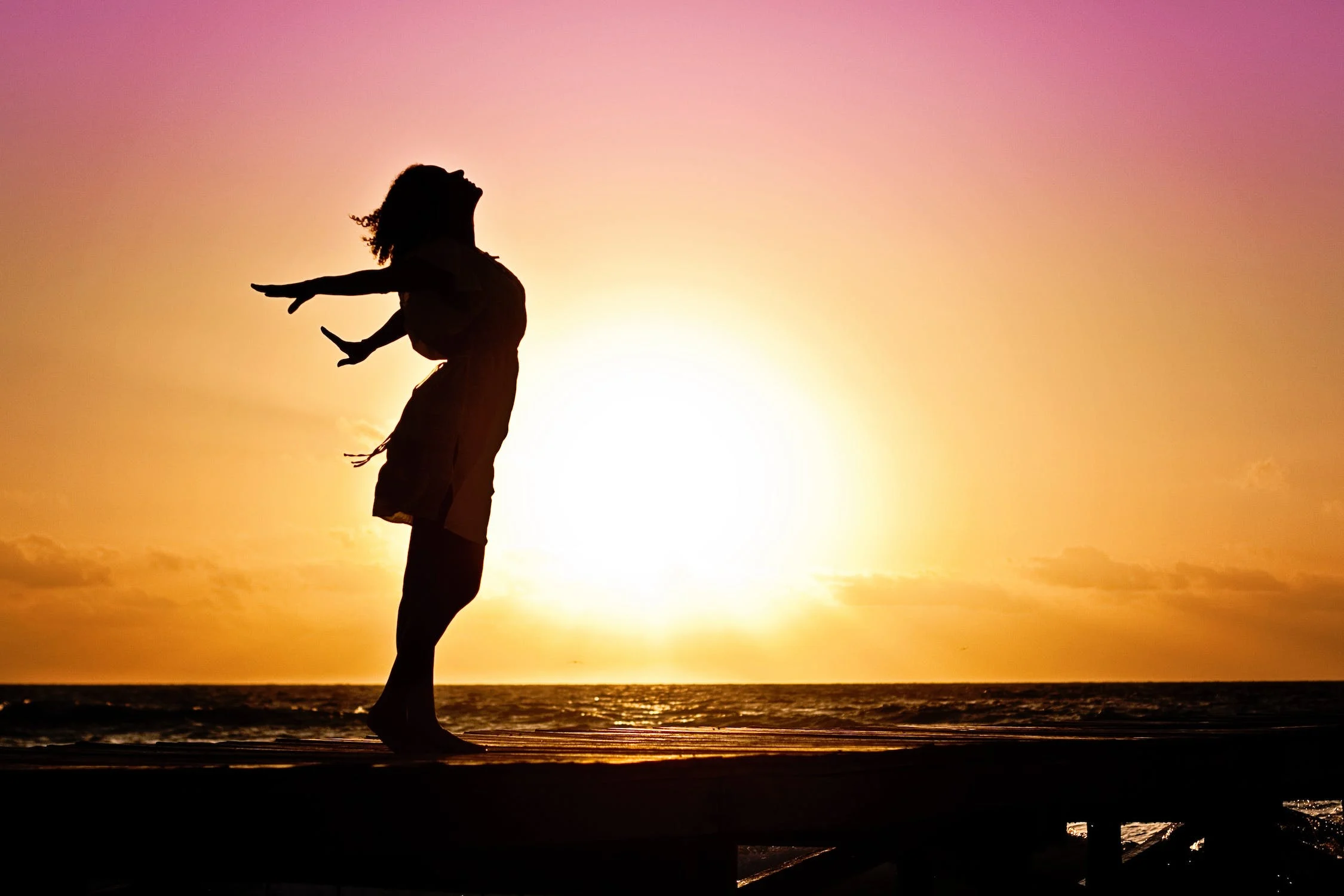 woman-happiness-sunrise-silhouette-40192.webp