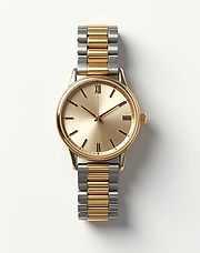 Two-tone gold and silver watch with a champagne dial