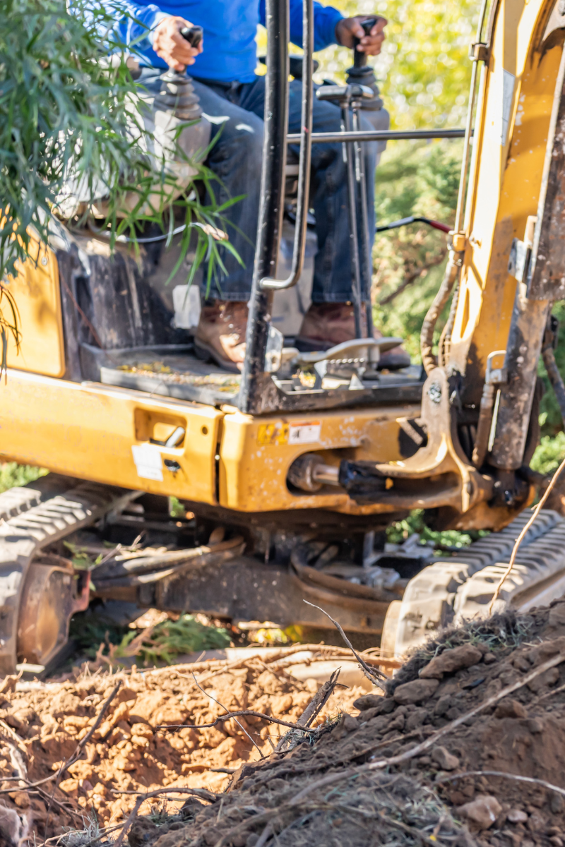 An image showcasing a professional operating an excavator, illustrating the essential steps for property excavation preparation. Perfect for understanding how to prepare your property for excavation projects.