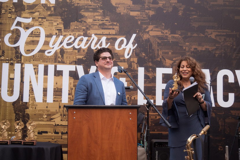 Sam Moss, Executive Director and Marcia Contreras. Deputy Executive Director presenting the Quezada Award.